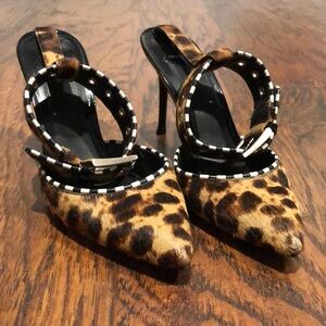 Leopard with black white trim silver buckle strap. Tip and heel just replaced.